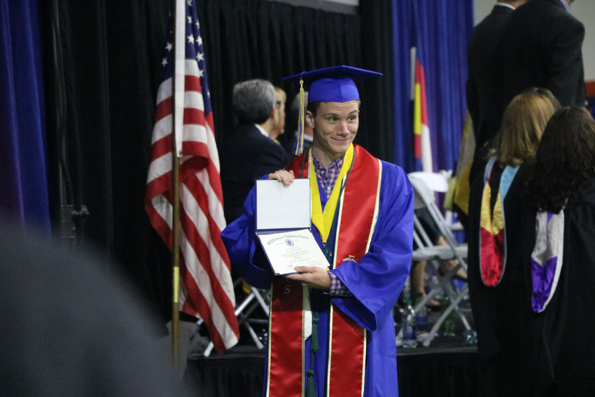 Brendan Bialy, one of three STEM Highlands Ranch students who helped take down a gunman on May 7, receives his diploma at a May 20 commencement ceremony. Bialy plans to join the Marines.